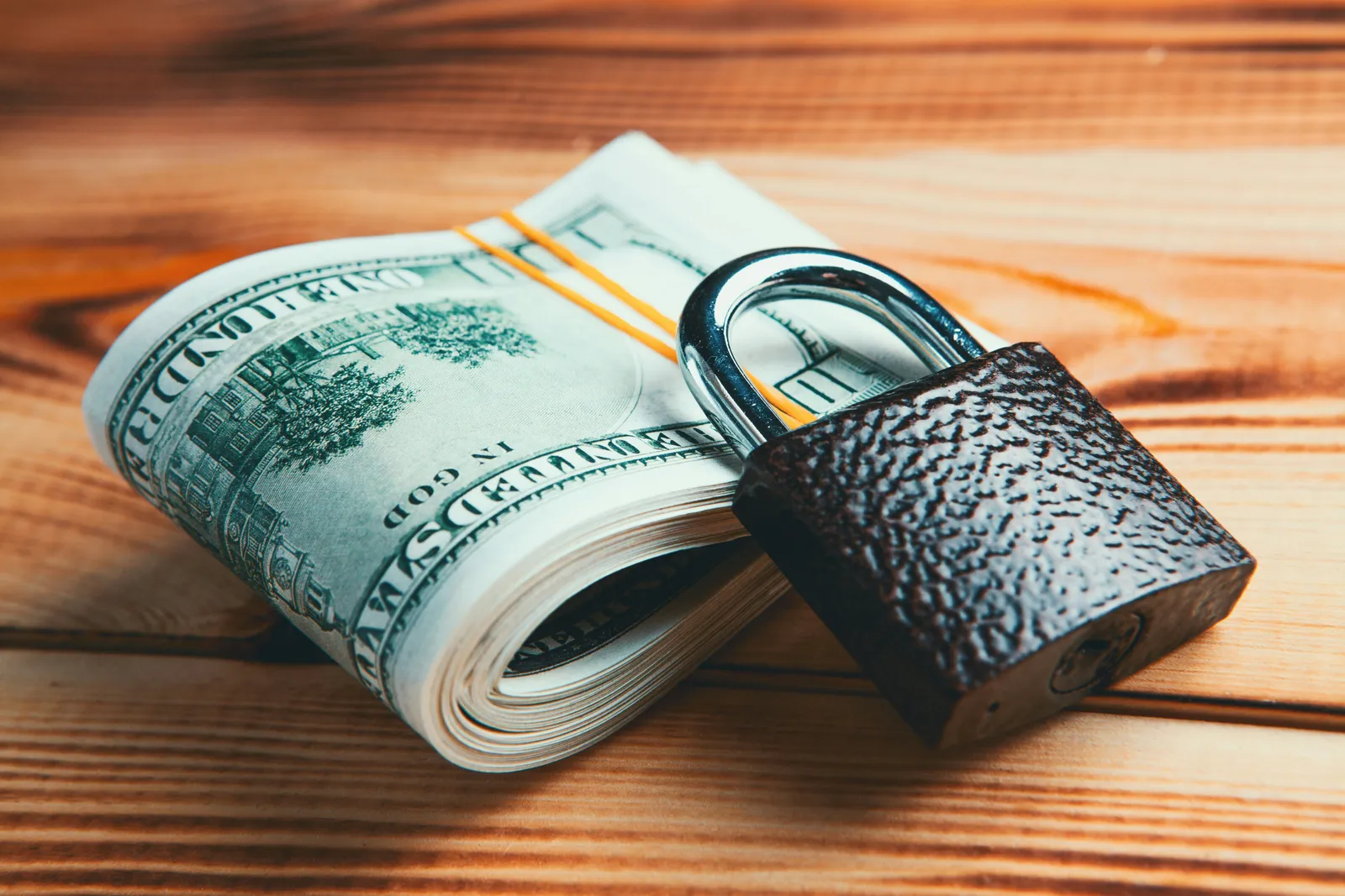 20 us dollar bill and a lock illustrating the revocable trusts