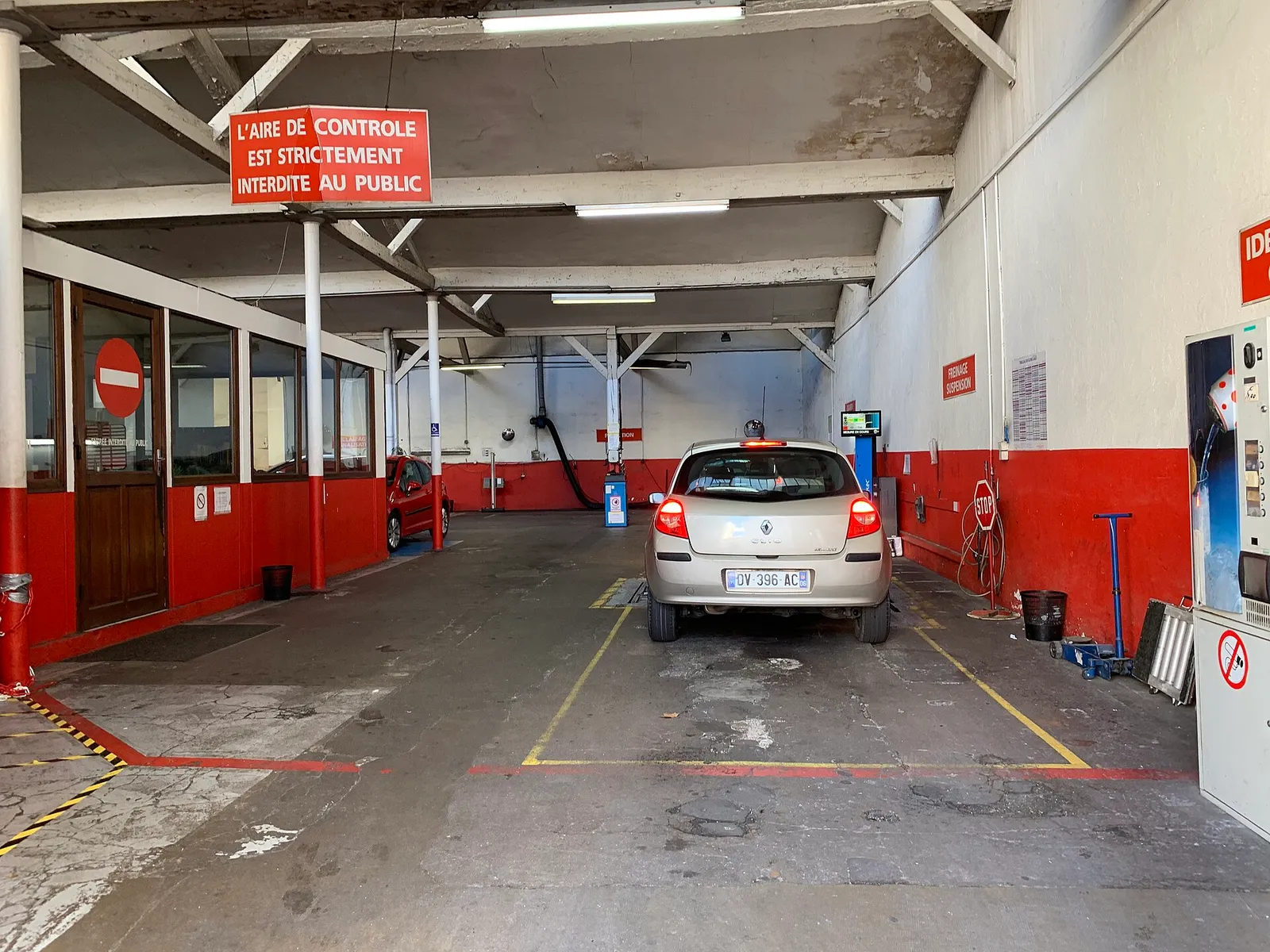 A car in the inspection bay of a vehicle technical inspection centre in Lyon