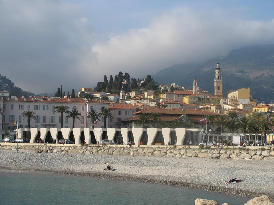 The old town of Menton above the beach